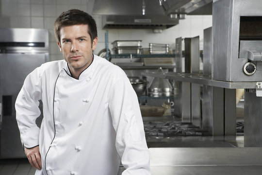 Portrait of a confident male chef standing in the kitchen