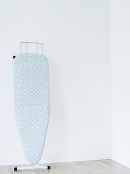 Ironing Board Against White Wall