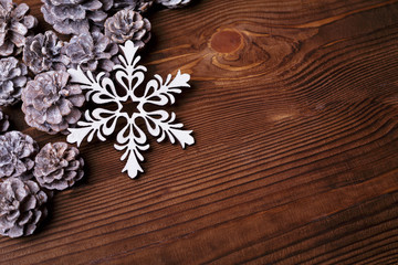 Christmas background with xmas tree and sparkle bokeh lights on wooden canvas background. Merry christmas card. Winter holiday theme. Happy New Year. Space for text. Happy Holidays