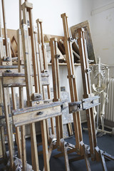 View of group of easels in empty artist's studio