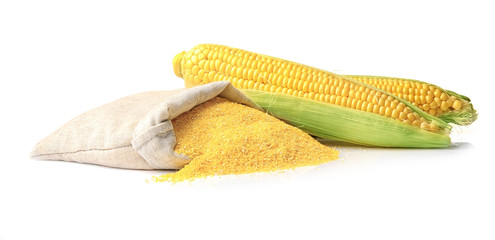 Bag with cornmeal and corncobs isolated on white