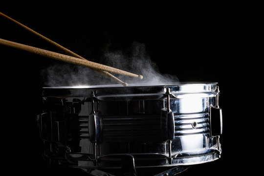 Drum sticks hit on the snare drum