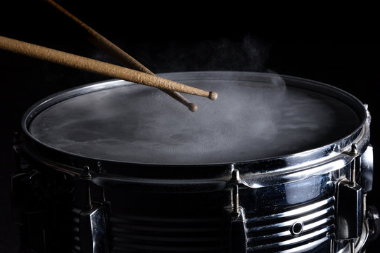Drum sticks hit on the snare drum