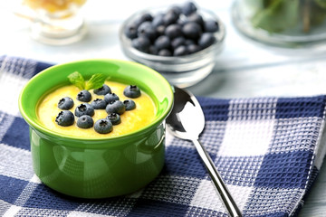 Delicious cornmeal porridge with blueberry on napkin