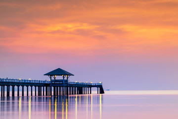 Summer, Travel, Vacation and Holiday concept - Wooden pier between sunset in Phuket, Thailand