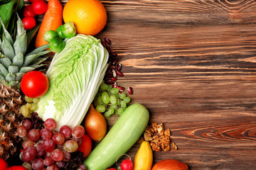 Fruits and vegetables on wooden background