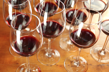 Glasses of red wine on bar counter