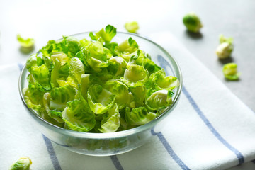 Closeup of Brussels sprouts in glass bowl on napkin