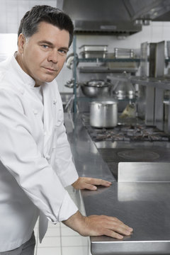 Portrait of a confident male chef standing in the kitchen