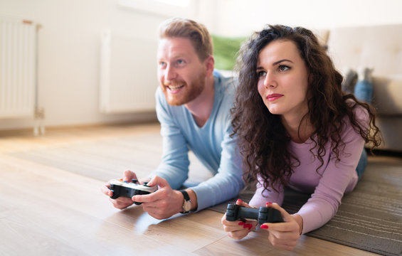 Beautiful Couple Playing Video Games On Console