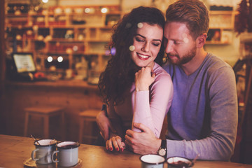 Couple dating in cafe at xmas