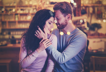 Fototapeta premium Couple dating in cafe at xmas