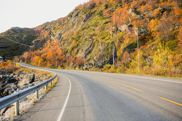 The road along the sea coast. Mountains, autumn, sunset.