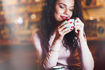 Woman enjoying aromatic coffee