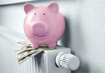 Heating battery with piggy bank on it