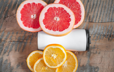 Fruits. Orange, grapefruit. White bottle