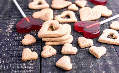 Fototapeta na wymiar Candy and cookies in shape of hearts for Valentines day