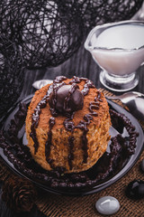 Chocolate cake on the black wooden table