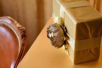 A lot of Christmas gifts near a chair in the living room