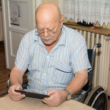 Senior man using a digital tablet