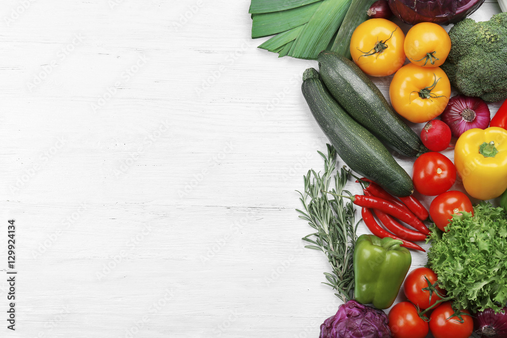 Wall mural Fresh vegetables on wooden background