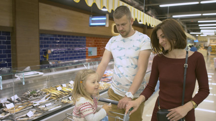 Family makes purchases in the supermarket