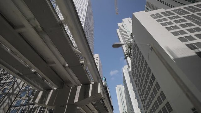 Downtown Miami, Street scene with skytrain, skyscrapers, Shops, streets, Restaurants, Miami, Florida, USA, Sep 2016, camera movement