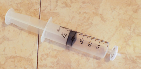 Syringe for filtration on a laboratory desk