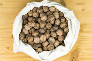 Pile of freshly harvested walnuts in their shells