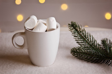 beautiful Christmas background with marshmallows in a white Cup