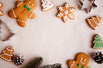 beautiful Christmas background with gingerbread men, Christmas trees and snowflakes with pine cones