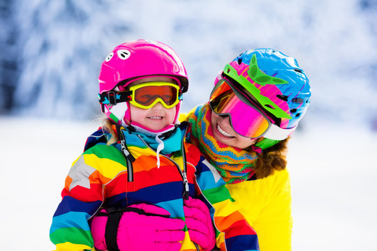 Family ski and snow fun in winter mountains