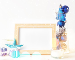 Christmas mock up with photo frame and toys in glass
