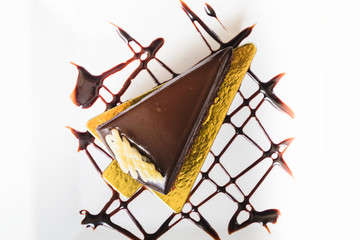top view piece of chocolate cake on white dish