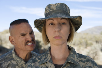 Fototapeta premium Military officer yelling at female soldier during a training session