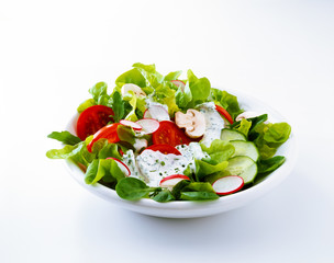 Salad with tomato, radishes, and dressing