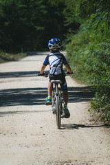 Obraz na płótnie Canvas Boy mountain biking