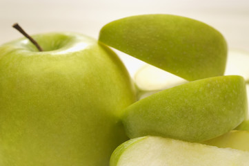 Fresh green granny smith apple with slices