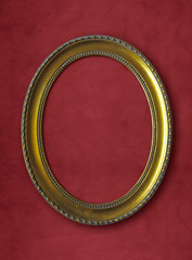 golden oval vintage frame isolated on red background with clipping paths