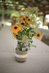 Rustic Wedding Centerpieces: Black Eyed Susans and Queen Anne's Lace in Burlap Wrapped Mason Jars