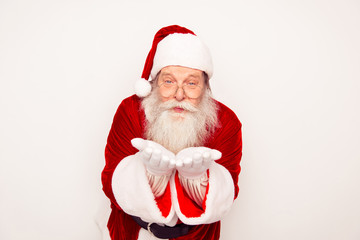 Portrait of old Santa Claus sending air kiss on white background