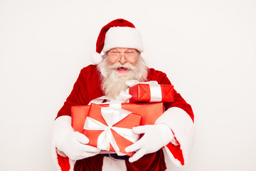 Happy Santa Claus holding boxes with xmas gifts