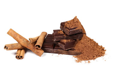 chocolate bars with cinnamon sticks and pile cocoa powder isolated on white  