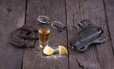 tequila, handcuffs, gun