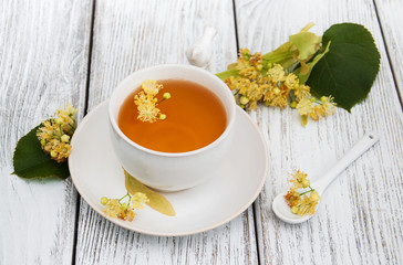 cup of herbal tea with linden flowers