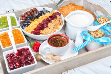 French breakfast on a wooden tray. Breakfast in bed