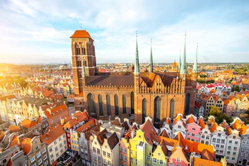 Fototapete Cityscape aerial view on the old town with saint Marys church on the sunset in Gdansk, Poland © rh2010