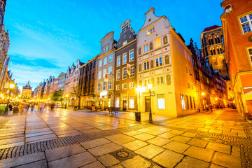 Night view on the illuminated main street in the center of the old town in Gdansk, Poland - obrazy, fototapety, plakaty