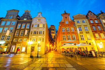 Night view on the illuminated houses at the main street in the center of the old town in Gdansk, Poland