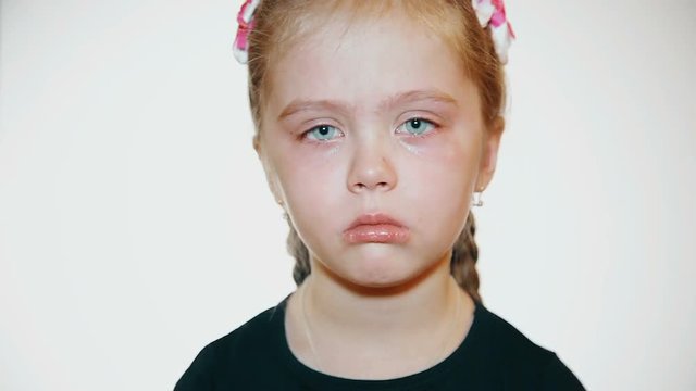 Child crying - a little girl crying against a white background
